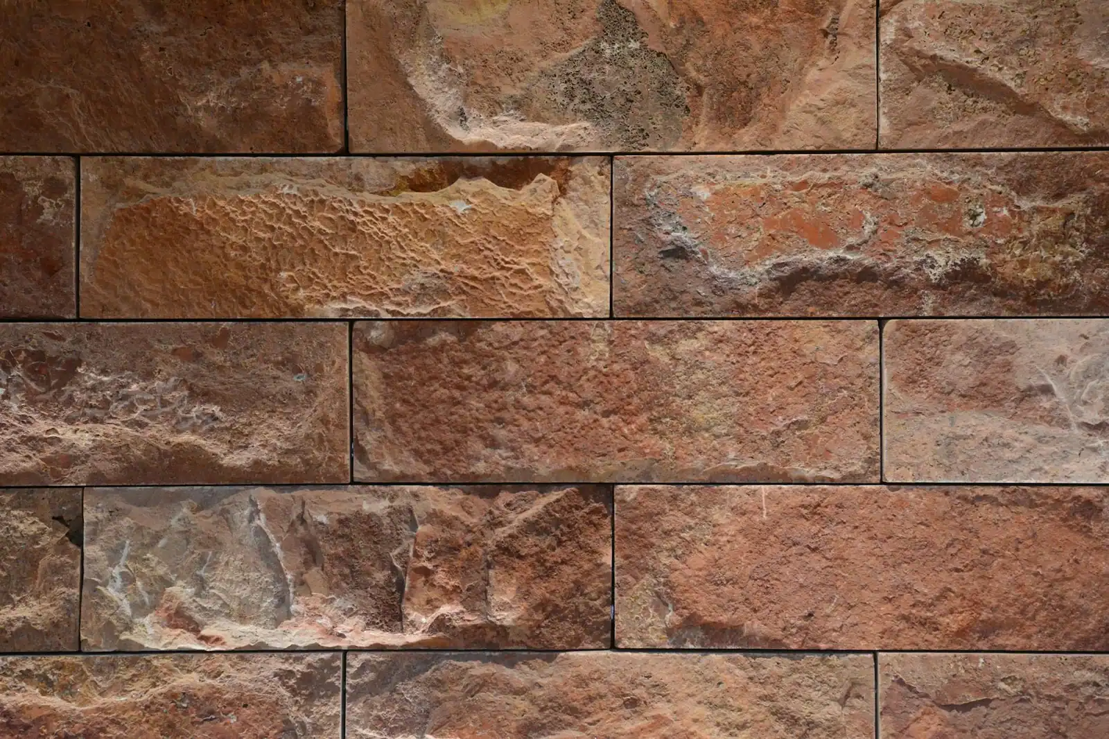High-resolution image of a textured brick wall, ideal for backgrounds or design projects.